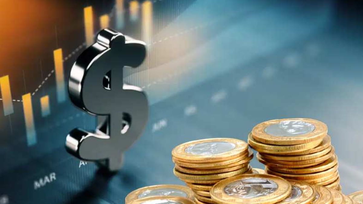 Moedas de Real e cifrão representando como o conceito de receita bruta mudou para as PMEs depois da Reforma Tributária
