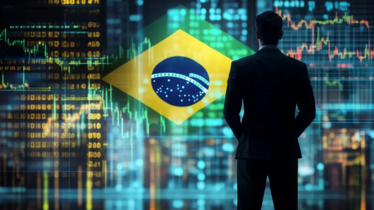 Empresário diante de um gráfico financeiro com a bandeira do Brasil, representando investimento estrangeiro na Bolsa